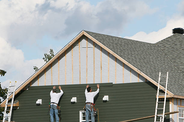 Professional Storm Damage Siding Repair technician working in Mendota, IL
